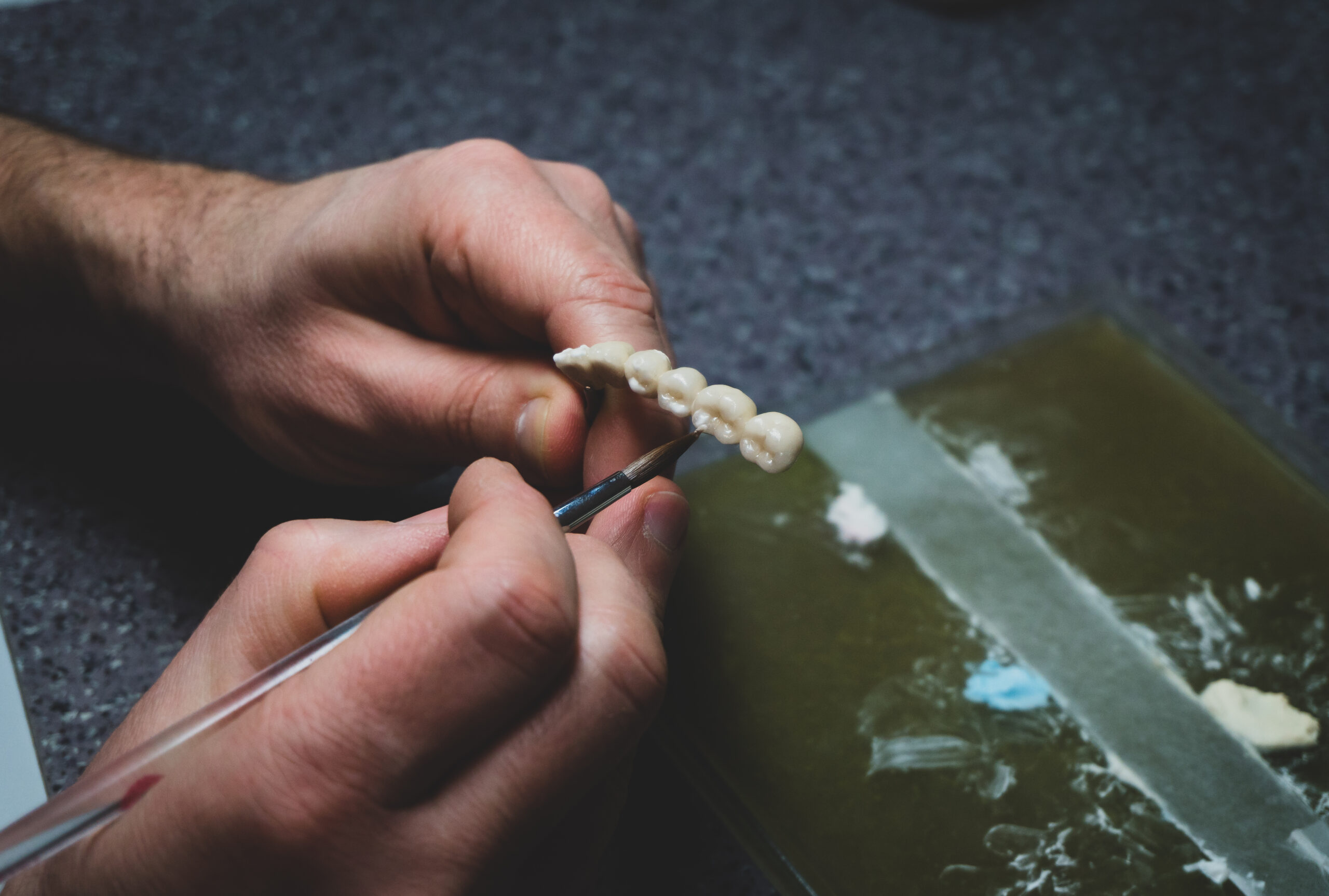 dental technician makes dental crowns. close-up.